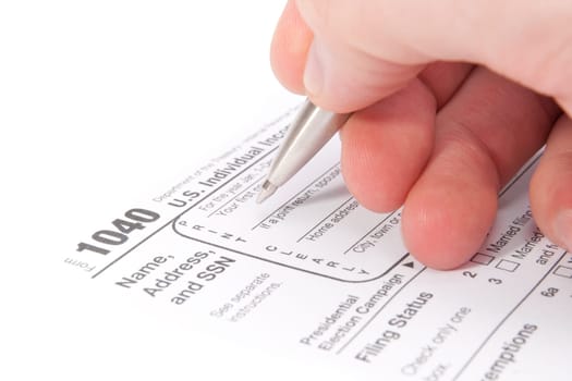 Accountant filling tax form by hand