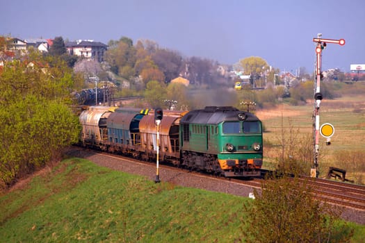 Freight train passing the hilly landscape