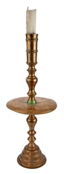 Antique brass candle holder with white pillar candle. Isolated over white.