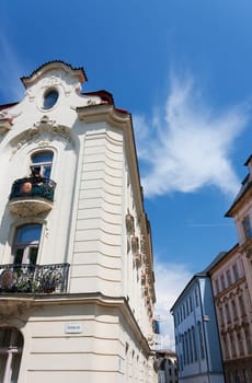 Facade of typical buildings from Czech Republic and nice sky in background