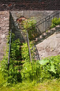 Old stairs abandoned and covered of vegetation