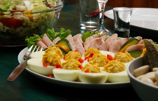 Photo shot of the eggs and pork on table