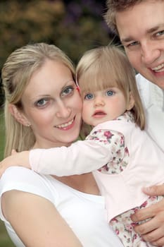 Young happy family with child - portrait