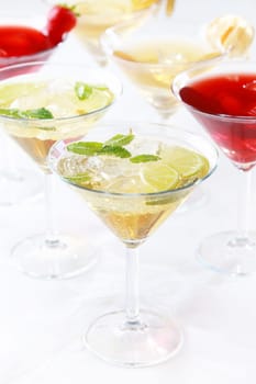 Different cocktails or longdrinks garnished with fruits