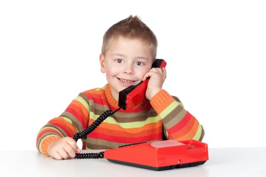 Adorable child with a tradicional telephone isolated over white