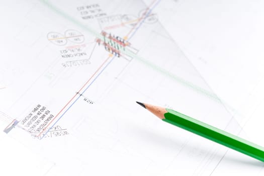 Detail of an industrial plan with green pencil in studio