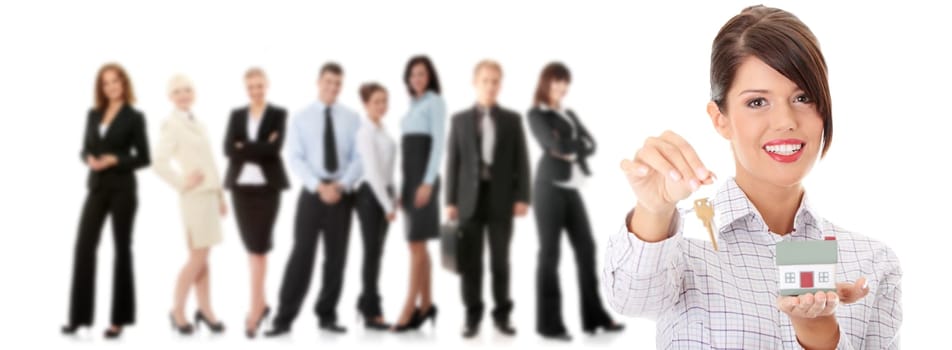 Young businesswoman  (real estate agent) with hose model and keys
