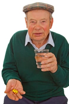 Senior taking tablets - isolated on white background