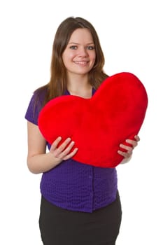 Friendly young woman with heart - isolated on white background