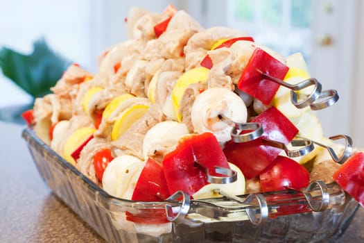 A stack of marinated kabobs ready for grilling