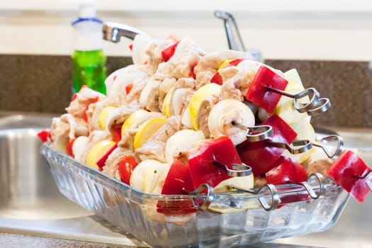 A stack of marinated kabobs ready for grilling