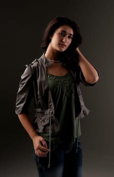 beuatiful young fashion teenager on dark gray