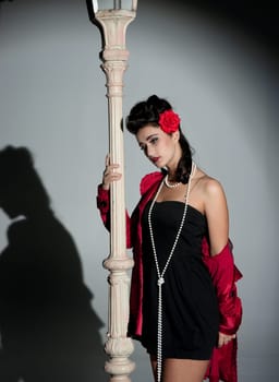 beautiful young glamorous woman  with lightpole