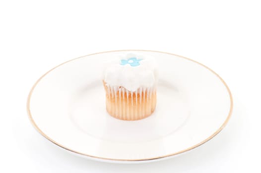 little iced cupcake isolated on white background