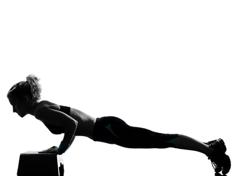 one woman exercising workout fitness aerobic exercise abdominals push ups posture on studio isolated white background