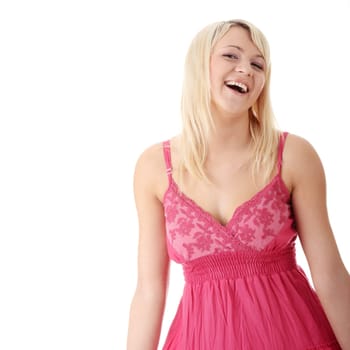 Young beautiful girl in short summer pink dress isolated on white
