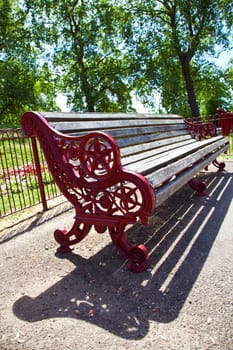 Empty red bench in park