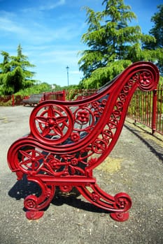 Empty red bench in park