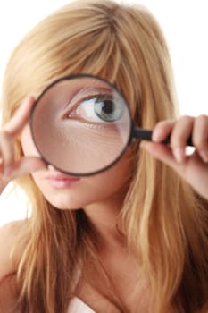 Young teenage girl with magnifier / searching and exploring concept