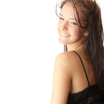 Young woman in sexy black lingerie dancing with wind. Isolated