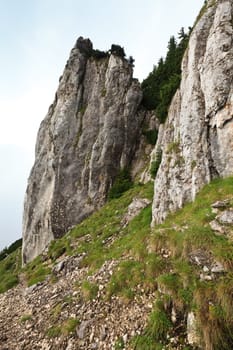 a mountain slope and a cloudy background