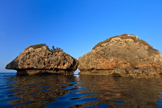 a beautiful reflection of stones in the sea, beach Porto Zoro, Zakynthos, Greece