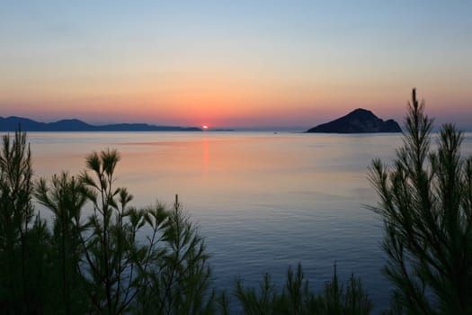 a beautiful sunrise over a calm sea