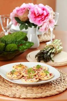 Small cheesy cakes as appetizer on the table