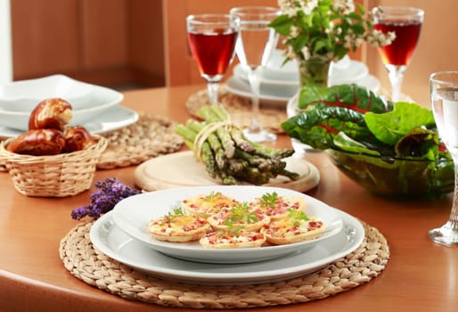Small cheesy cakes as appetizer on the table
