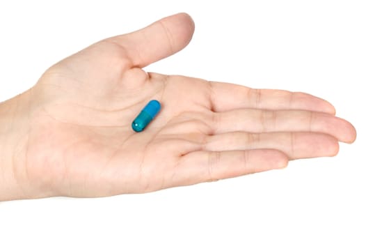 Photo of a hand with a pill over a white background