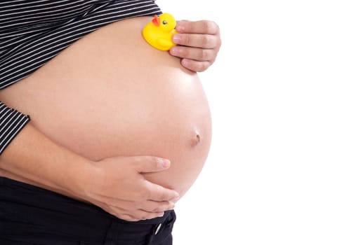 Pregnant woman playing with spotted toy duck