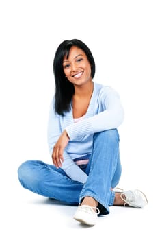 Relaxing black woman sitting on floor isolated on white background