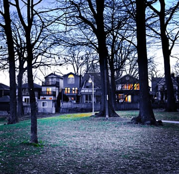 City park at dusk near residential houses