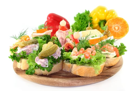 Various canapes against white background