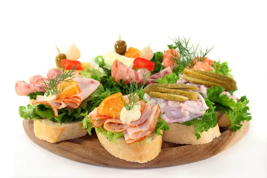 Various canapes against white background