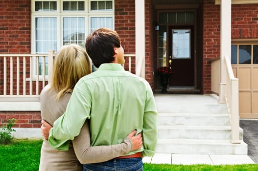 Young happy couple shopping for new home