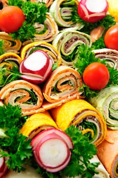 Closeup on platter of assorted meat tortilla wraps