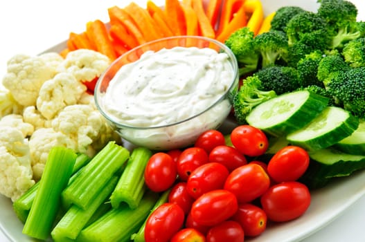 Platter of assorted fresh vegetables with dip