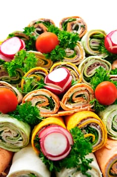 Closeup on platter of assorted meat tortilla wraps