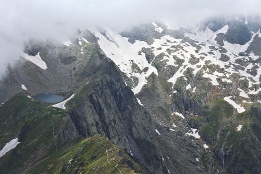 a small lake in a mountain slope, Fagaras mountains, Romania