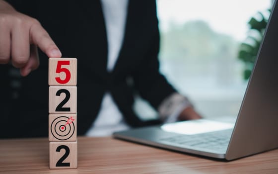 Wooden blocks lined up with the letters 2025. Represents the goal setting for 2025, the concept of a start. financial planning development strategy business goal setting