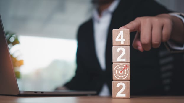 Wooden blocks lined up with the letters 2024. Represents the goal setting for 2024, the concept of a start. financial planning development strategy business goal setting