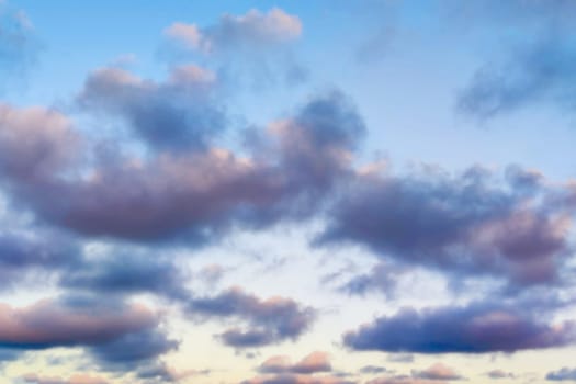 dark rain clouds on blue sky for celestial background.