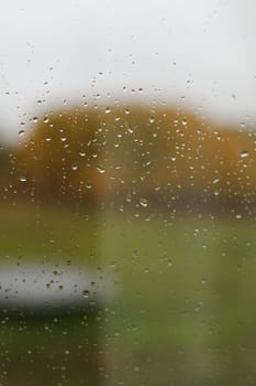 Water drops on glass texture abstract autumn nature background,Selective focus. Natural pattern of rain drops on window glass surface