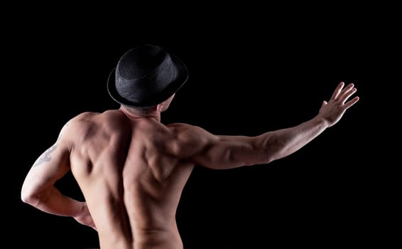 sexy young strong man posing in desire isolated