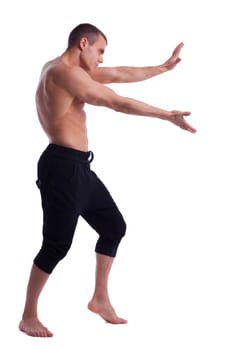 sexy young strong man posing in desire isolated