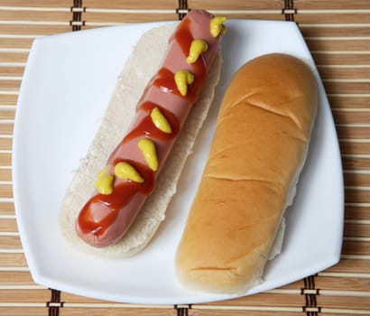 a hot dog in a white plate