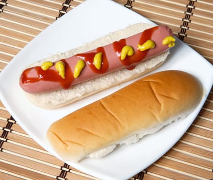a hot dog in a white plate