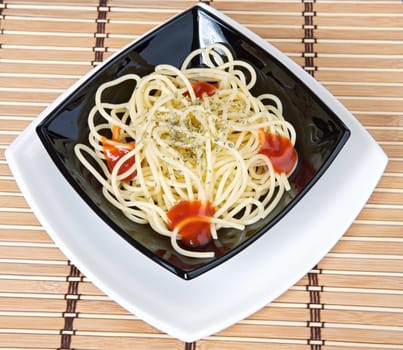 paste with tomato in the black plate