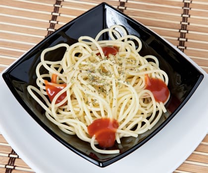 paste with tomato in the black plate